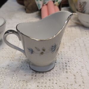 Elegant lady By international Silver Creamerwith Silver Trim/Floral